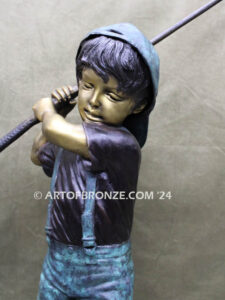 In My Fathers Shoes bronze sports statue of budding golfer boy hitting ball