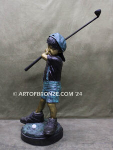 In My Fathers Shoes bronze sports statue of budding golfer boy hitting ball