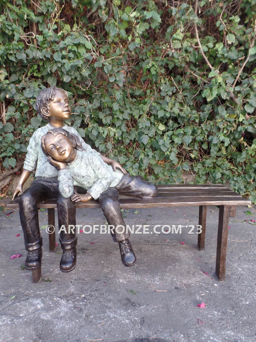 Cherished Moments bronze statue of two kids relaxing on bench