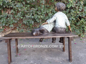 Cherished Moments bronze statue of two kids relaxing on bench