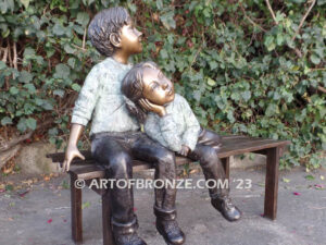 Cherished Moments bronze statue of two kids relaxing on bench