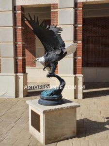 Colleyville Municipal Court Eagle of Justice outdoor monumental statue of an eagle landing atop granite pillar
