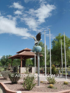 Evergreen Cemetery Veterans Memorial bronze statues of eagle on globe and boy saluting flag