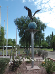 Evergreen Cemetery Veterans Memorial bronze statues of eagle on globe and boy saluting flag