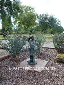 Evergreen Cemetery Veterans Memorial bronze statues of eagle on globe and boy saluting flag