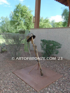 Evergreen Cemetery Veterans Memorial bronze statues of eagle on globe and boy saluting flag