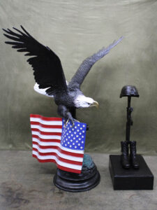 Guardians of Valor eagle and fallen soldier battlefield cross military memorial statue