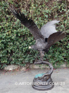 Majesty monumental bronze sculpture of eagle landing on branch