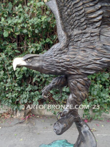 Majesty monumental bronze sculpture of eagle landing on branch