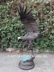 Majesty monumental bronze sculpture of eagle landing on branch