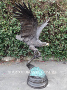 Majesty monumental bronze sculpture of eagle landing on branch