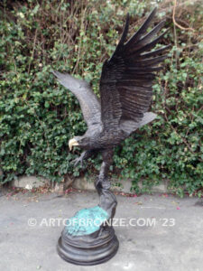 Majesty monumental bronze sculpture of eagle landing on branch