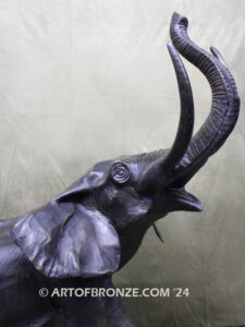 Triumphant March majestic bronze cast statue of walking elephant