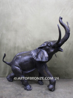 Triumphant March majestic bronze cast statue of walking elephant