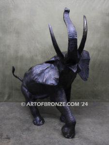 Triumphant March majestic bronze cast statue of walking elephant