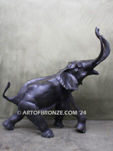 Triumphant March majestic bronze cast statue of walking elephant