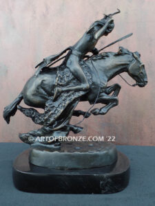 The Cheyenne bronze sculpture after Frederic Remington featuring warrior on galloping horse