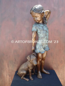 Girls Best Friend bronze sculpture of girl playing with puppy