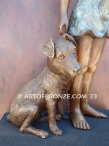 Girls Best Friend bronze sculpture of girl playing with puppy