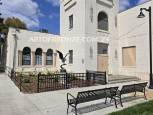 Orland Memorial Hall outdoor monumental sculpture of an eagle landing on branch