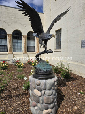 Orland Memorial Hall outdoor monumental sculpture of an eagle landing on branch