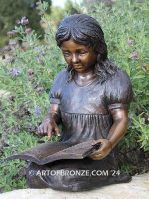 Tales and Dreams bronze statue of young girl reading her favorite novel