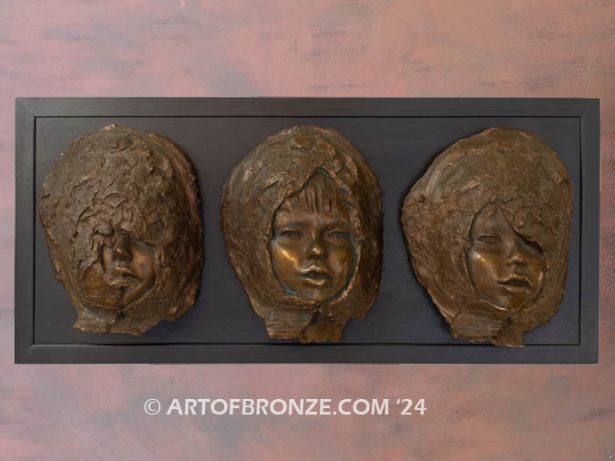 Emergence contemporary bronze statue wall display of young child’s facial expressions