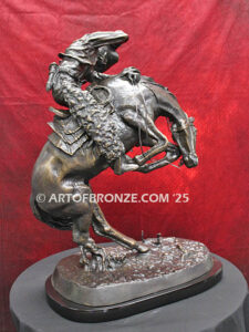 Rattlesnake bronze statue cowboy on bucking horse after Frederic Remington