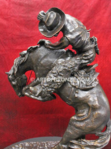 Rattlesnake bronze statue cowboy on bucking horse after Frederic Remington