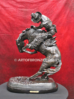 Rattlesnake bronze statue cowboy on bucking horse after Frederic Remington