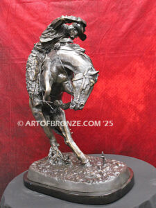 Rattlesnake bronze statue cowboy on bucking horse after Frederic Remington