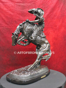 Rattlesnake bronze statue cowboy on bucking horse after Frederic Remington