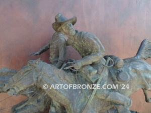 Wounded Bunkie bronze statue of two cavalry troopers on horseback after Frederic Remington