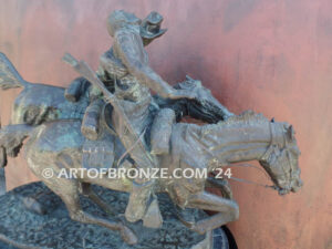 Wounded Bunkie bronze statue of two cavalry troopers on horseback after Frederic Remington