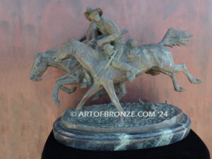 Wounded Bunkie bronze statue of two cavalry troopers on horseback after Frederic Remington