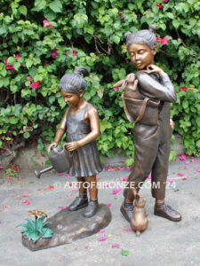 Blooming Love bronze sculpture of girl holding watering flower