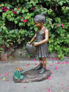 Blooming Love bronze sculpture of girl holding watering flower