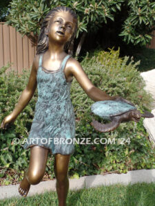 Joyful Discovery bronze sculpture of young girl running with sea turtle