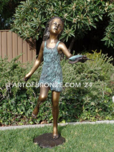 Joyful Discovery bronze sculpture of young girl running with sea turtle
