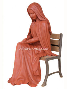 church or garden bronze sculpture Blessed Virgin Mary sitting on bench
