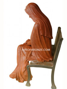 church or garden bronze sculpture Blessed Virgin Mary sitting on bench