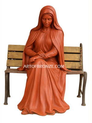 church or garden bronze sculpture Blessed Virgin Mary sitting on bench